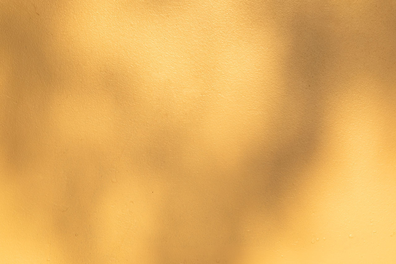 FULL FRAME SHOT OF WALL WITH YELLOW BACKGROUND