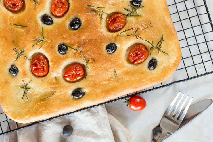 Baked pie with tomatoes and olives