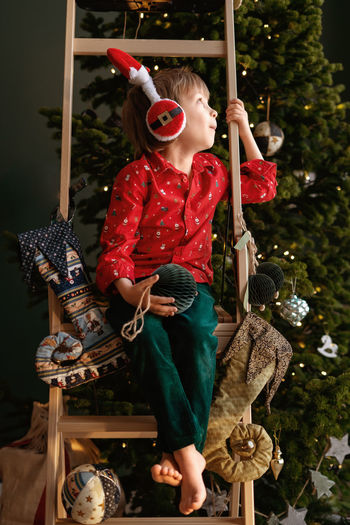 Rear view of woman with christmas decoration