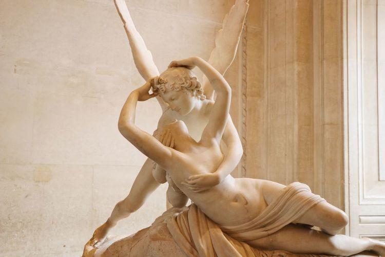 Marble sculpture called psyche revived by cupid's kiss on display in the louvre in paris, france.