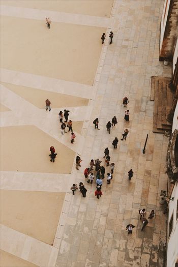 High angle view of people on tiled floor