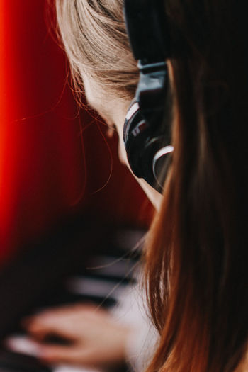Close-up of woman listening music