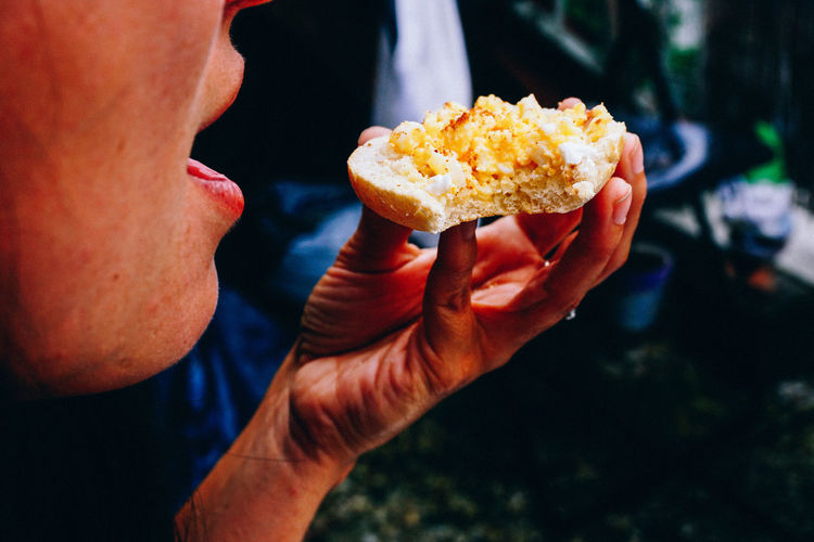 Cropped image of woman eating food
