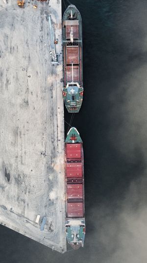 Stack of ship moored on sea against sky