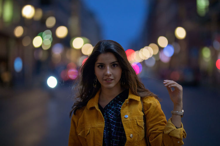 Portrait of young woman on street