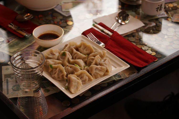 High angle view of food in plate on table. dumplings 