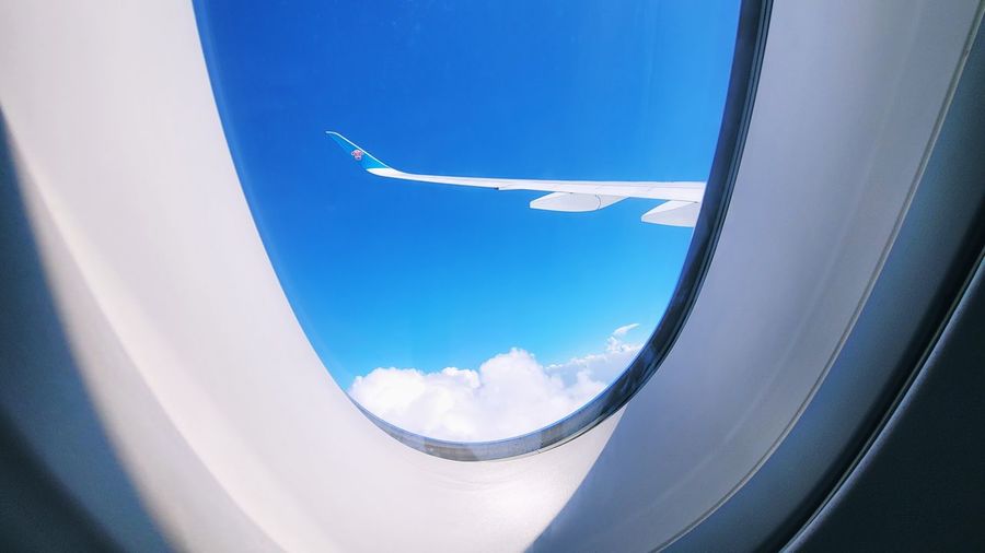 Airplane wing through airplane window 