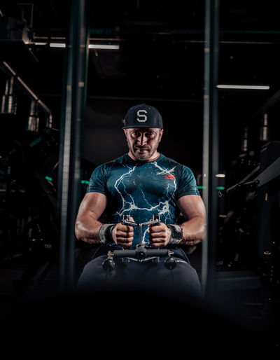 Rear view of man standing in gym