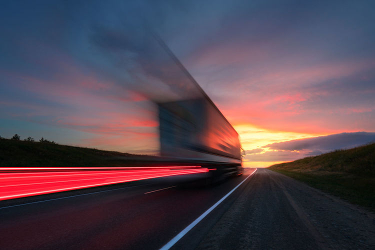 Blurring. a large truck is driving along the highway at high speed.. delivery of cargo.