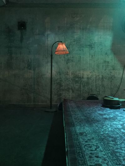 Lamp by wall in room