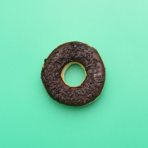 Directly above shot of donut against blue background