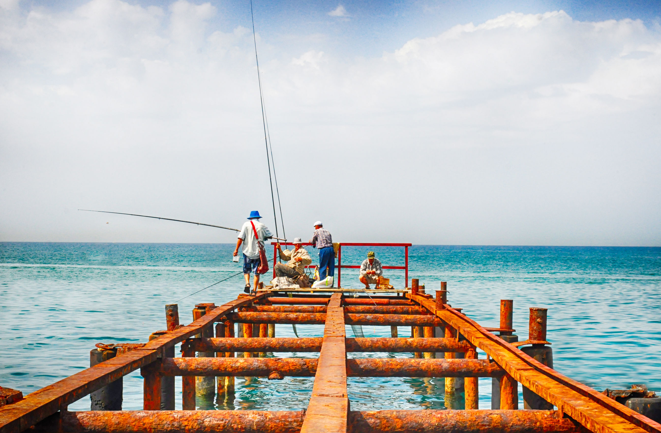 sea, water, horizon over water, men, sky, leisure activity, lifestyles, railing, pier, nature, scenics, person, medium group of people, blue, vacations, togetherness, beauty in nature, nautical vessel