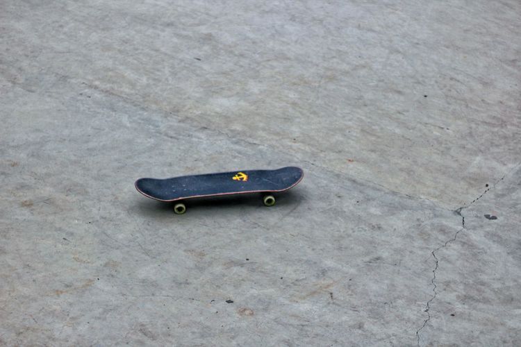 High angle view of skateboard on road