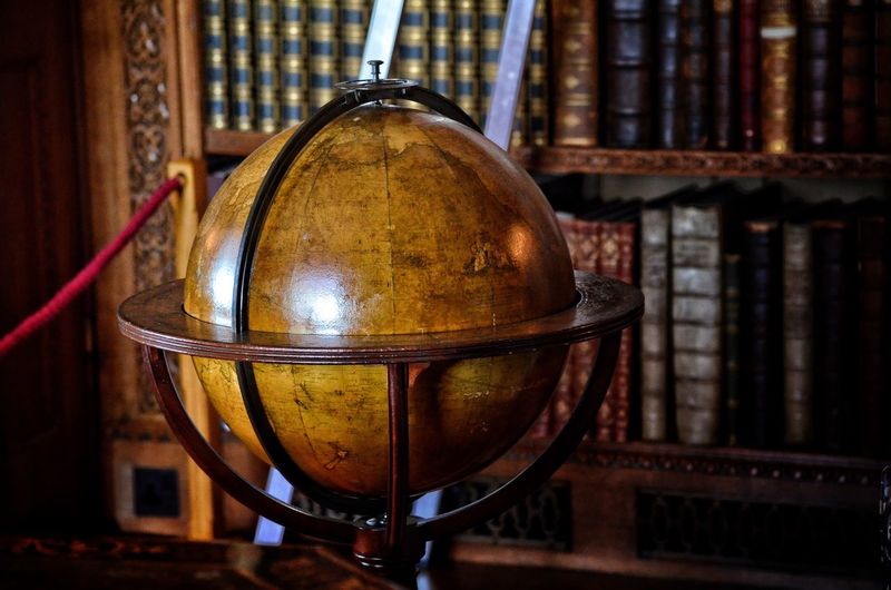 Globe against bookshelf