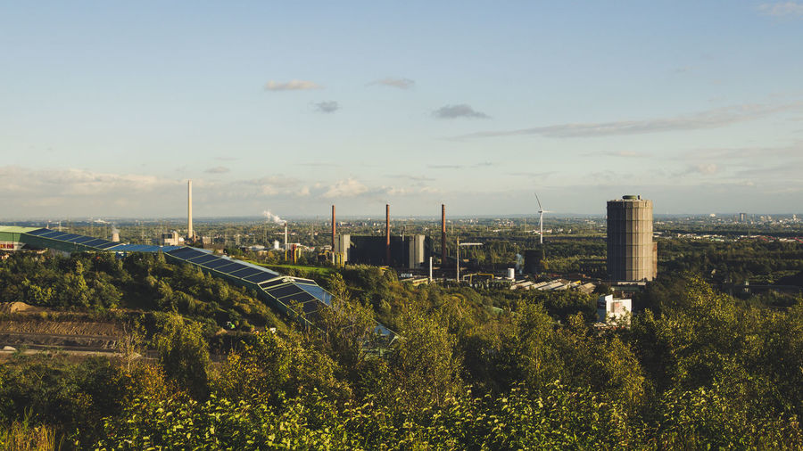 Panoramic shot of factory against sky