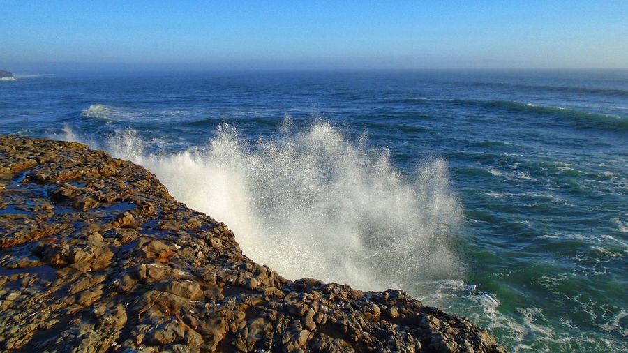 Scenic view of sea against clear sky