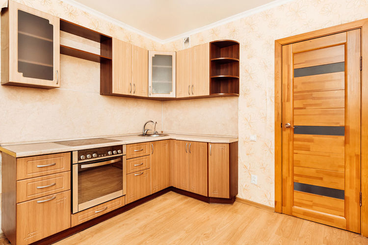Beautiful beige modern kitchen with appliances