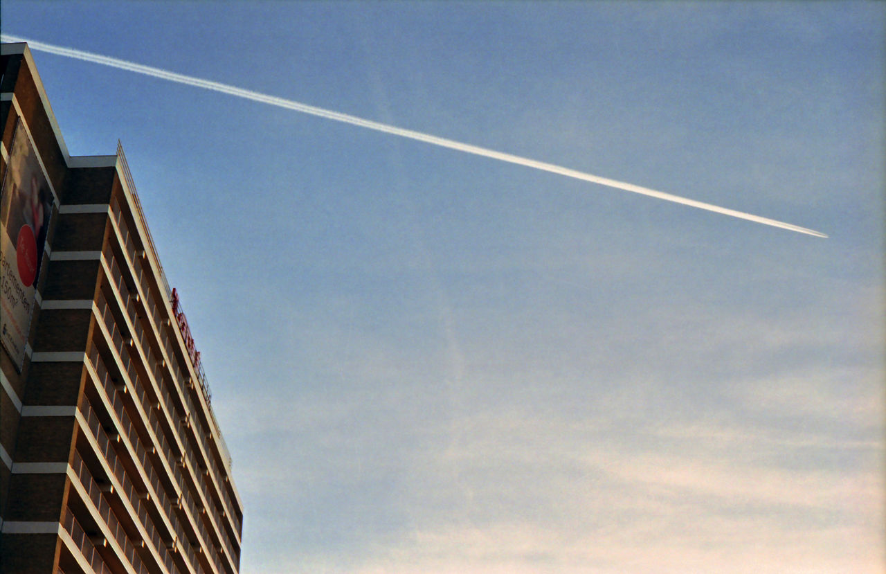 LOW ANGLE VIEW OF VAPOR TRAILS IN SKY
