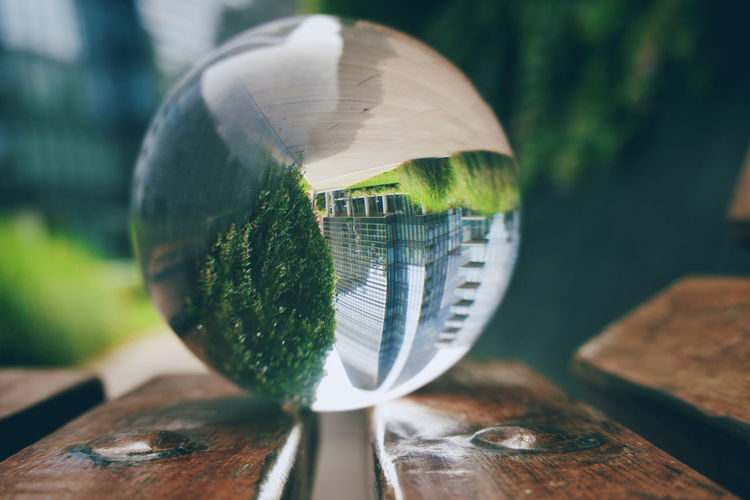Close-up of crystal ball on glass table
