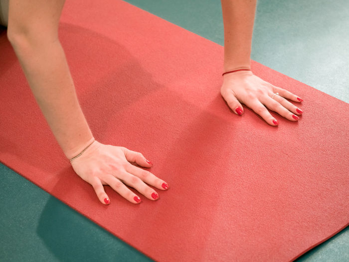 Close-up of woman doing yoga in studio