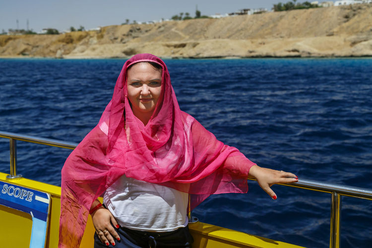 Portrait of young woman in boat