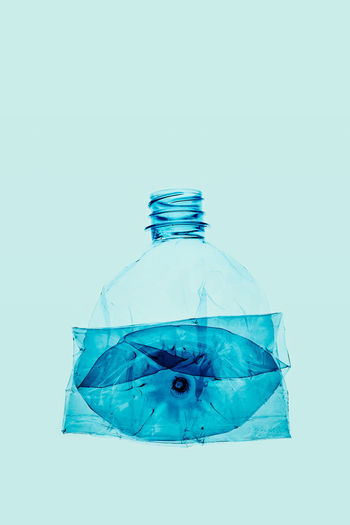 DIGITAL COMPOSITE IMAGE OF BLUE UMBRELLA