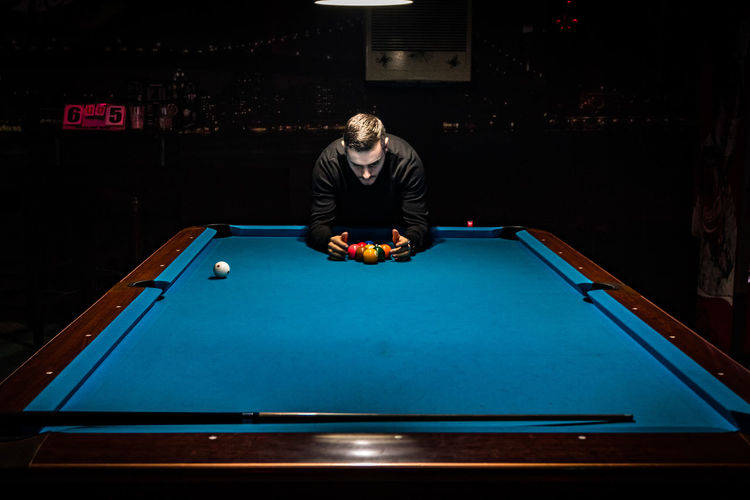 Man playing pool on table