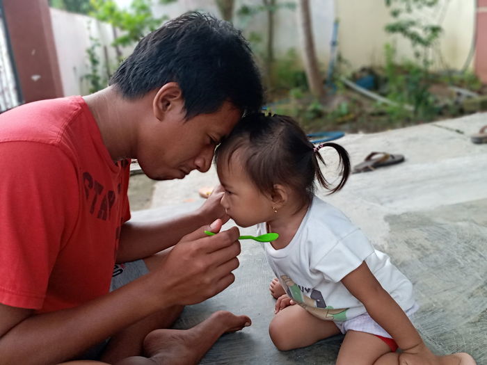 Father playing with daughter