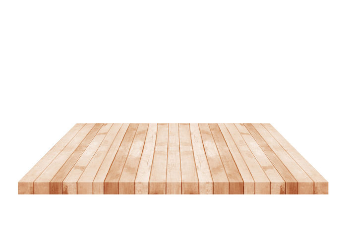 Close-up of wooden table against white background