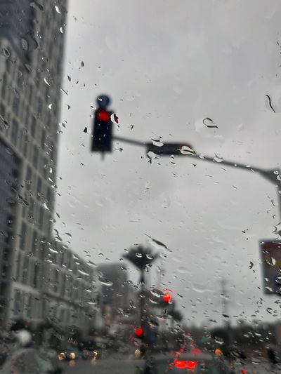 Cars on wet window during rainy season