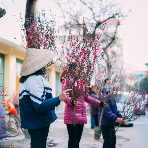 Women selling flowers on street