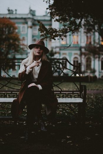 Woman sitting on bench at park