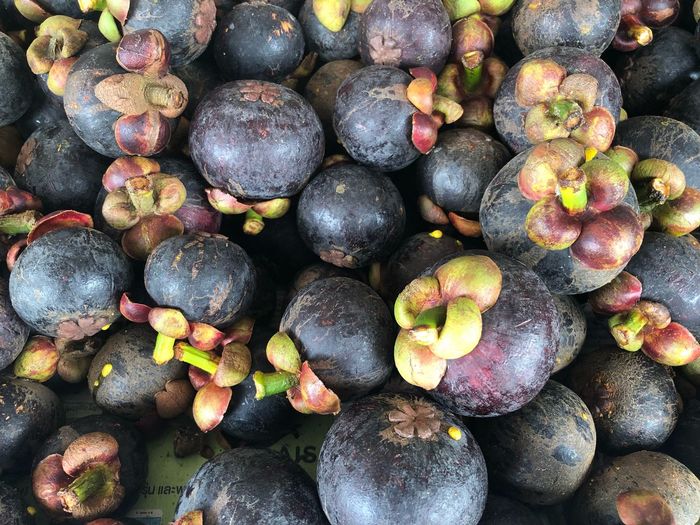 High angle view of mangosteen fruits in market