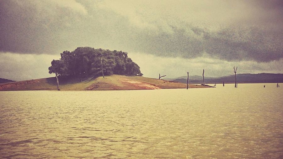 Scenic view of landscape against cloudy sky