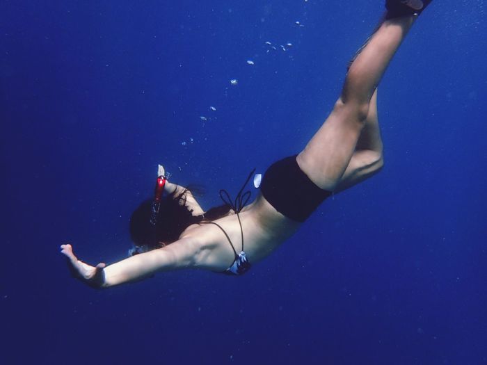 Young woman snorkeling in sea