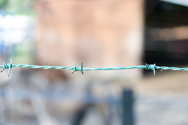 Detail of a barbed wire on a fence in the countryside
