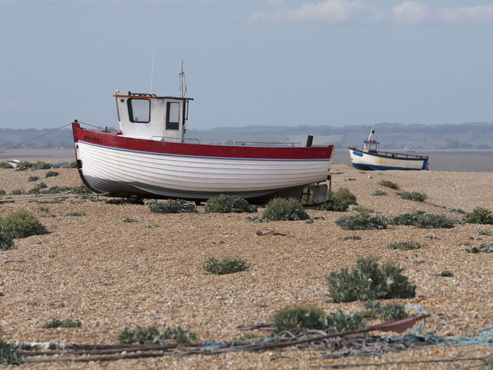 Ship moored on beach