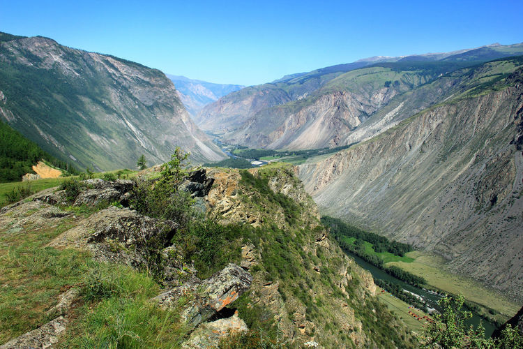 Rocky mountain slope overlooking the high-mountain chulyshman valley with the river in summer