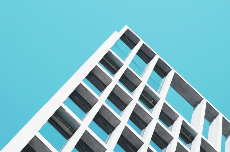Architecture Blue Building Building Exterior Built Structure Clear Sky Day Geometric Shape Low Angle View Modern No People Office Building Outdoors Repetition Sky Tall - High Hidden Gems Battle Of The Cities