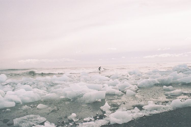 Scenic view of sea against sky during winter
