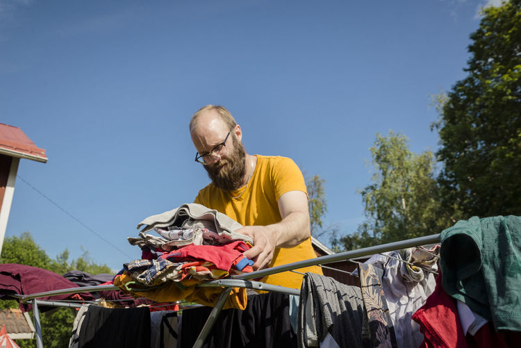 Man folding laundry