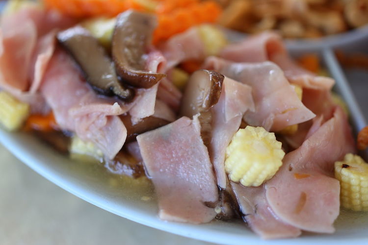 High angle view of chopped vegetables in plate on table