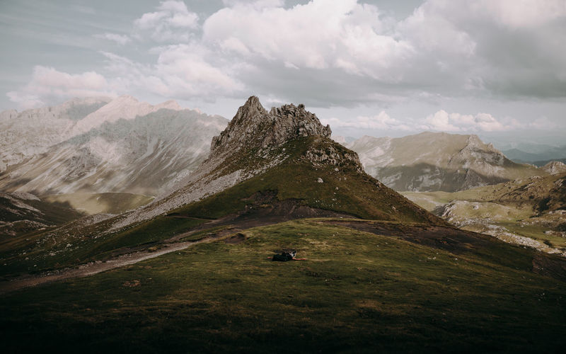 Scenic view of rocky landscape and mountains against sky