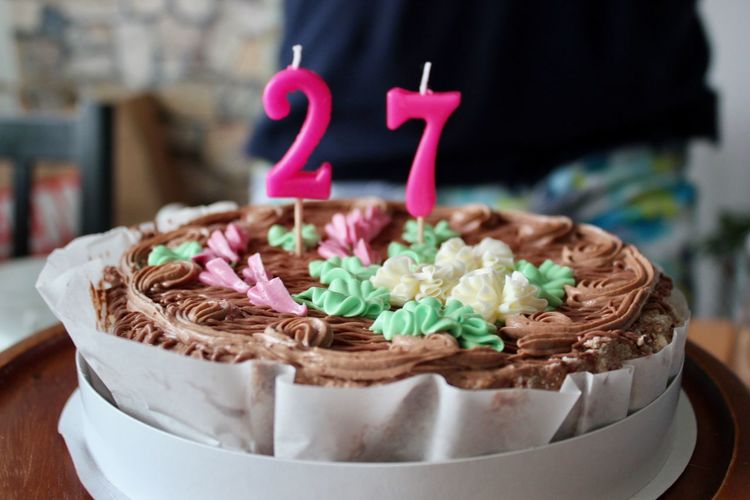 Close-up of number 27 candles on birthday cake