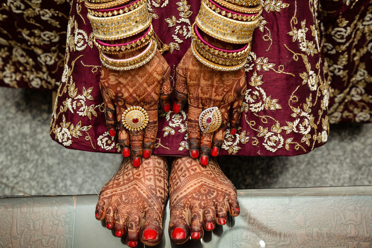 Low section photography of bride with henna tattoo 