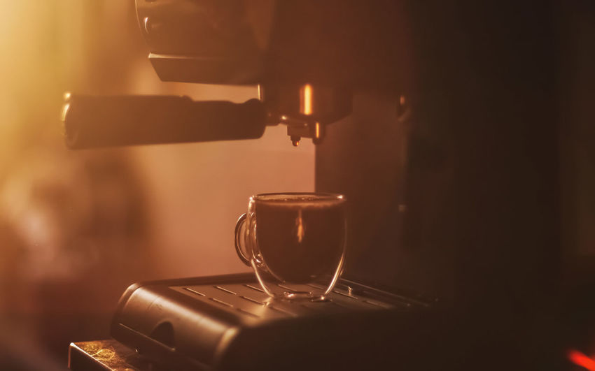 Close-up of pouring coffee in kitchen