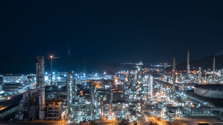  chemical industry storage tank and oil refinery in industrial plant at night over lighting, fuel 