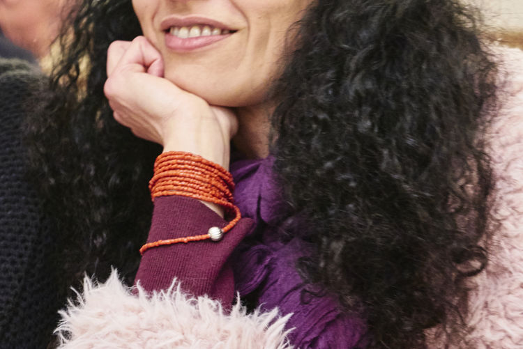 Close-up portrait of a smiling young woman in winter