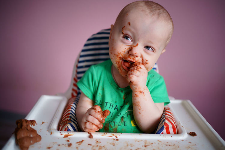 Baby stained in chocolate