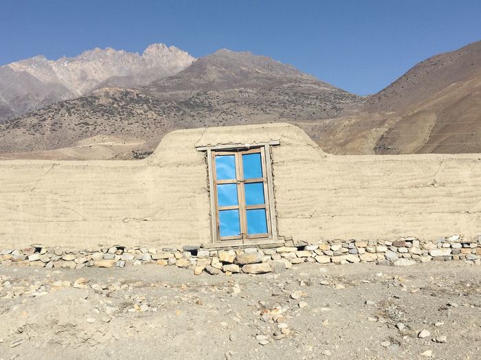 Built structure with mountain range in background